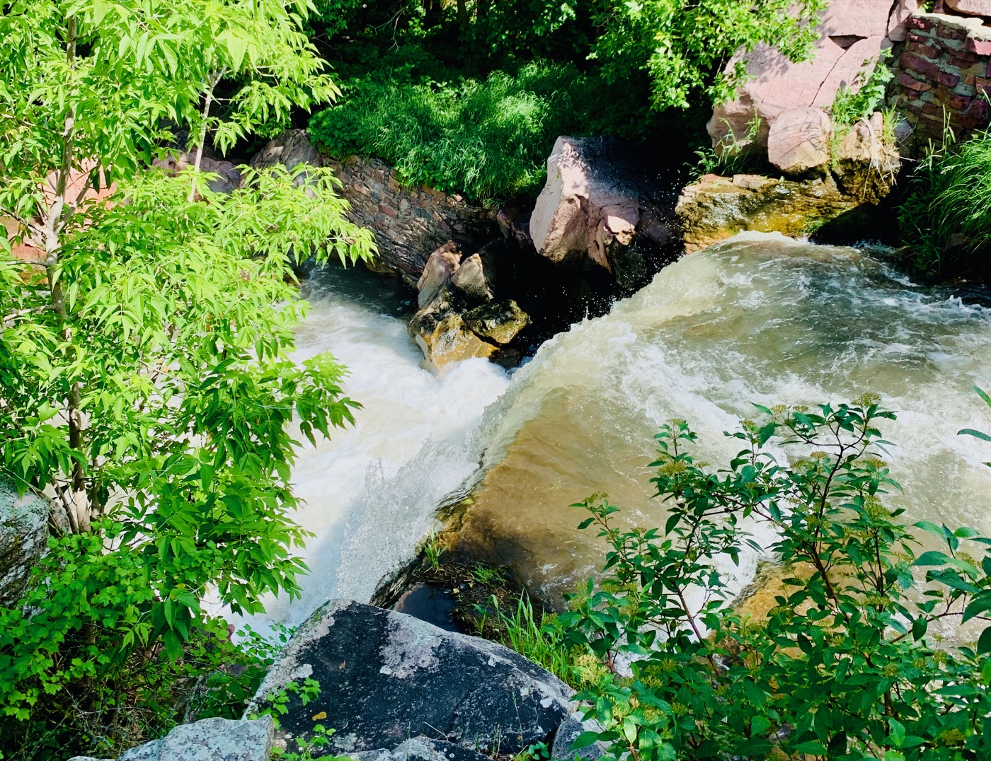 Winnewissa Falls — Pipestone Creek pouring white through the red quartzite