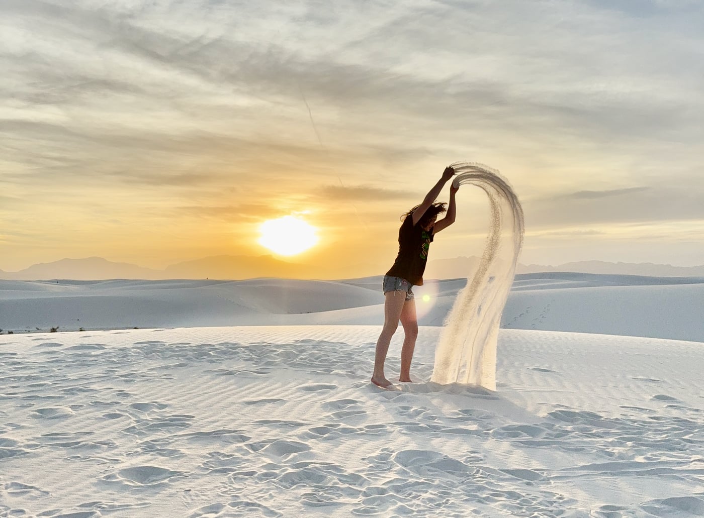 Phalen throwing sand in the sky, a fountain of gypsum catching the golden light