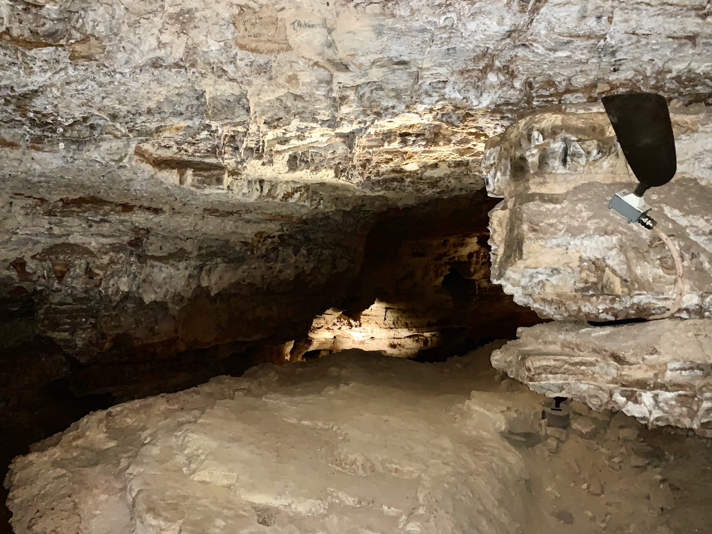 Inside Wind Cave — the cool, dim passageway where the breathing earth keeps its secrets